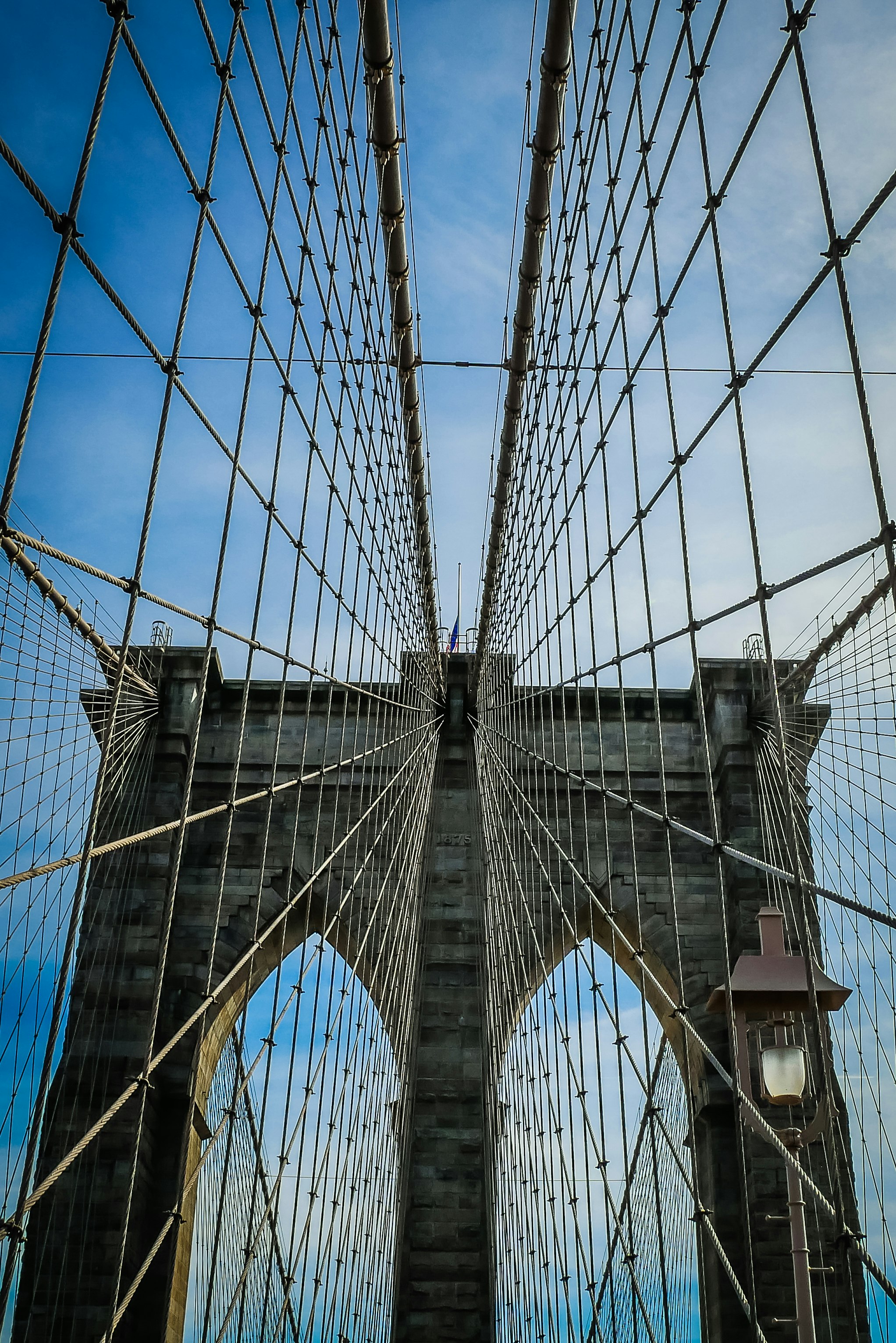 grey bridge under blue sky during daytime